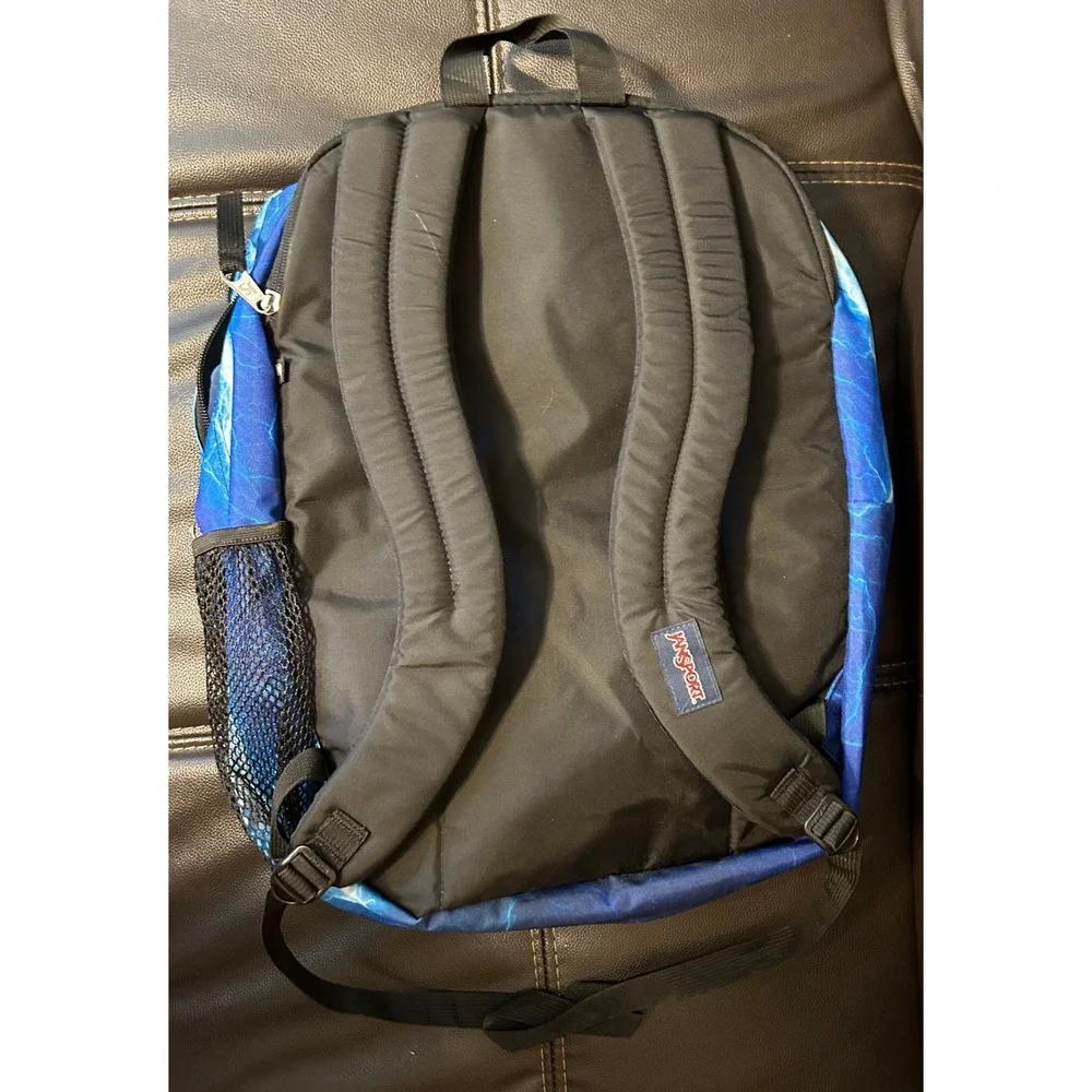 NWOT JanSport Back Pack, Blue Lightening. Multi Zip Pockets